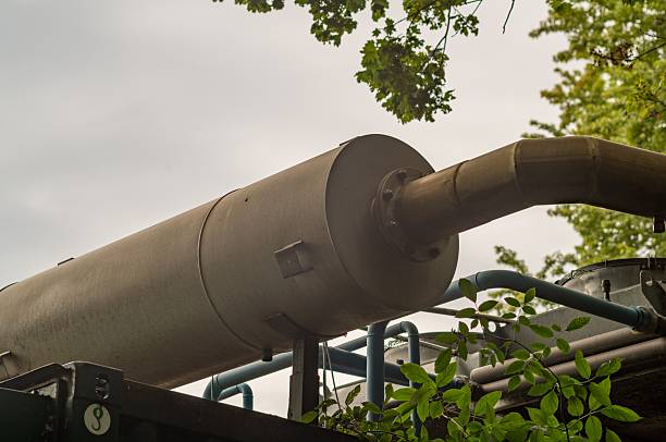 istock Large industrial exhaust pipe connecting to metal ductwork 2228977806