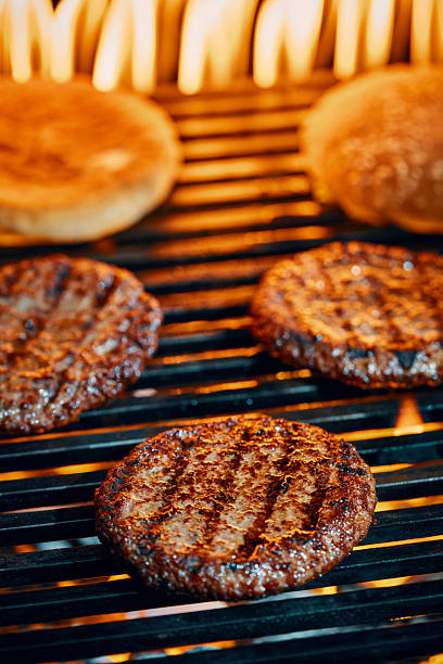 istock Burger Patties on BBQ Grill with Open Flames 2228979894