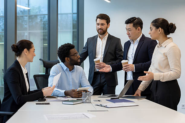 istock Business team having a discussion in a modern office environment. 2228981512