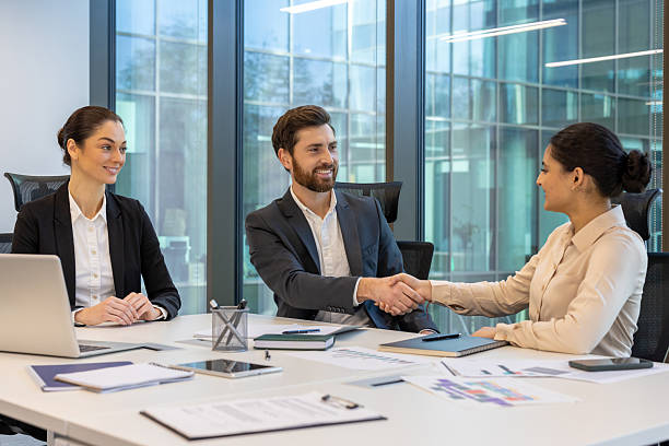 istock Professional meeting highlighting collaboration and handshake in modern office setting 2228981515