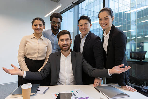 istock Diverse business team smiling confidently together in a modern office setting 2228981559