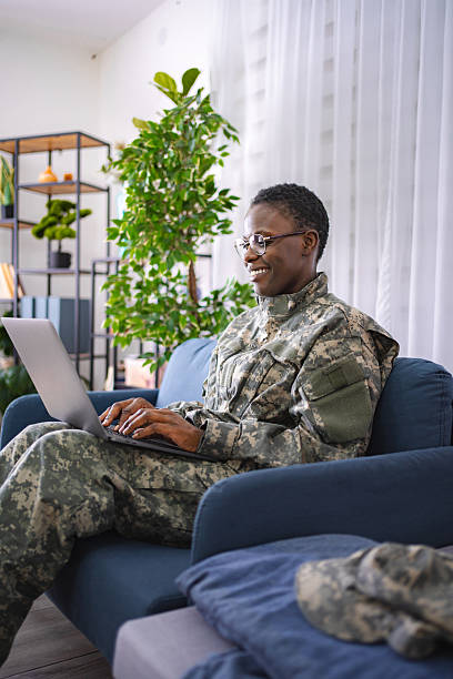 istock Military Professional Working on Laptop in Home Setting 2228981959