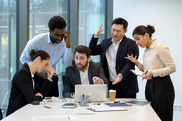 istock Team discussing issues during a tense business meeting in a modern office 2228985635