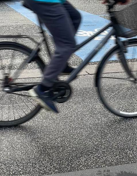istock Cycle lane marking and passing bike in motion 2228987380