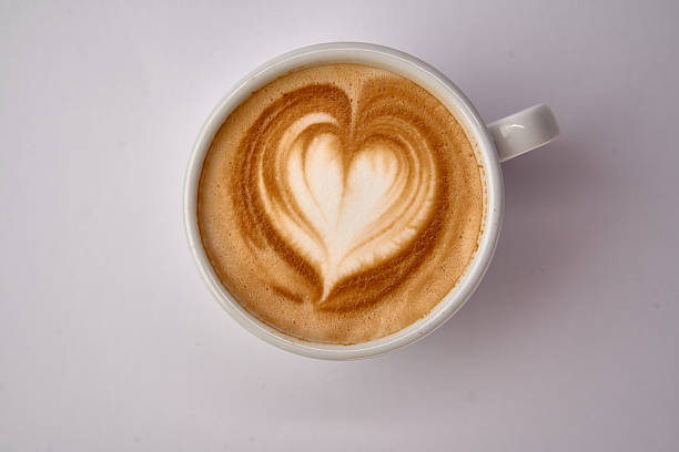 istock Delightful Heart-Shaped Latte Art in a White Ceramic Cup Captured from Above on a Clean White Surface 2228989571
