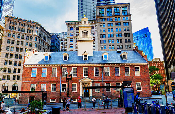 Boston, Massachusetts, USA - June 27, 2025: The Old State House building in downtown Boston. Through Massacre, Revolution, and fire, the Old State House stands as the oldest surviving public building in Boston. Built in 1713, the building served as the center of civic, political, and business life. It is one of the landmarks on Boston's Freedom Trail.