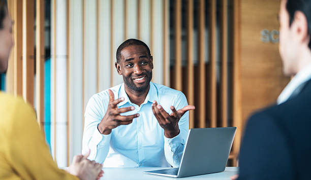 istock Confident team leader leading a discussion in a modern office 2228992348