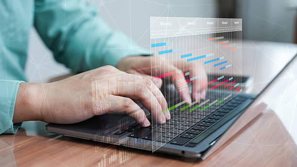 istock Hands typing on laptop keyboard with data analysis and graph overlay. Businessman working with digital dashboard, financial report, and futuristic technology interface. 2228993141