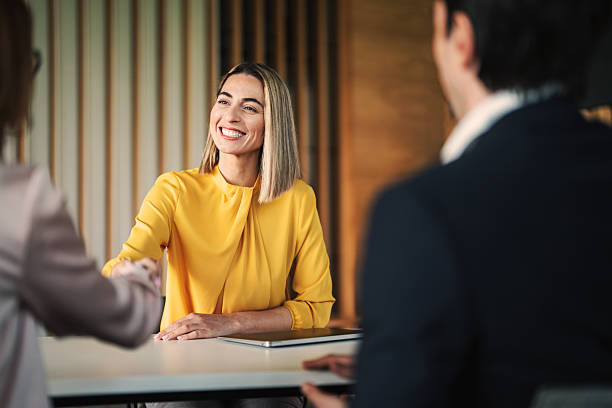 istock Meeting success. Business partners shaking hands 2228994772