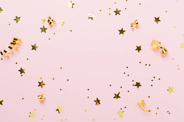 istock Golden gift boxes and confetti on color background, top view 2228995398