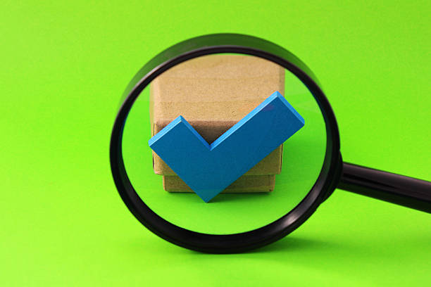 Modern toggle switch behind magnifying glass. 3d render