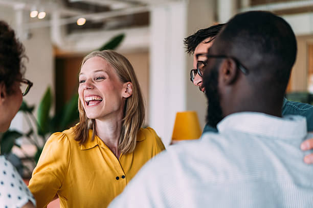 istock Excited coworkers embracing each other during a celebration in the office. 2229005049