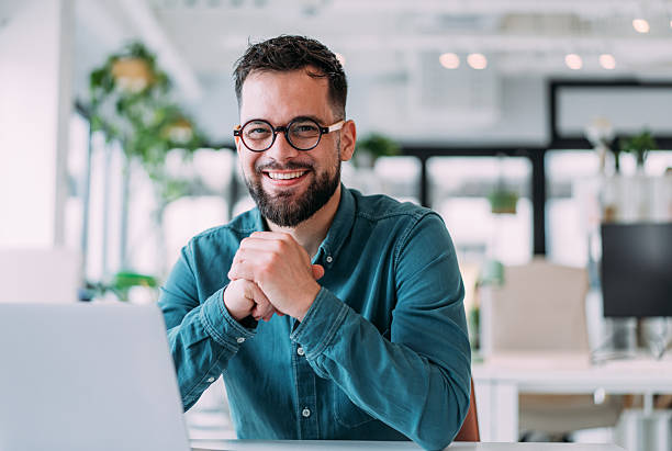 istock Successful businessman in modern office working on laptop. 2229005073