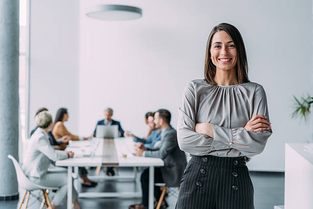istock Confident businesswoman and her team. 2229005870