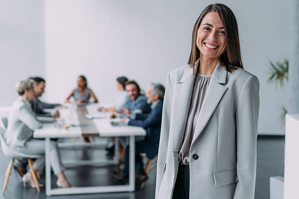 istock Confident businesswoman and her team. 2229005892