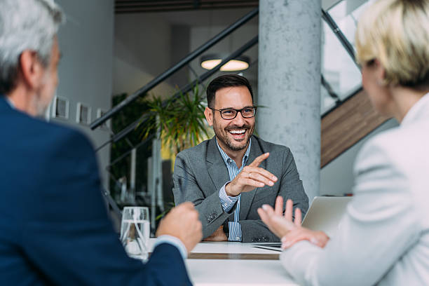 istock Group of business persons talking in the office. 2229005917