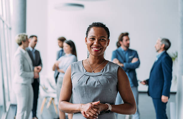 istock Confident businesswoman and her team. 2229005918
