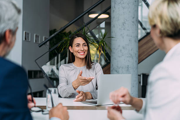 istock Group of business persons talking in the office. 2229005939