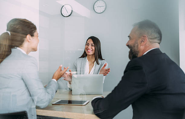 istock Group of business persons talking in the office. 2229005940