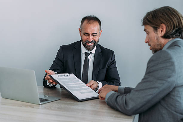 istock Business people signing a contract in the office. 2229005951