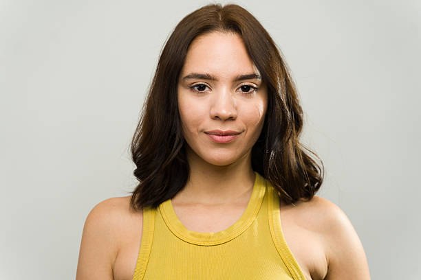 istock Portrait of confident young woman posing in studio setting 2229008898