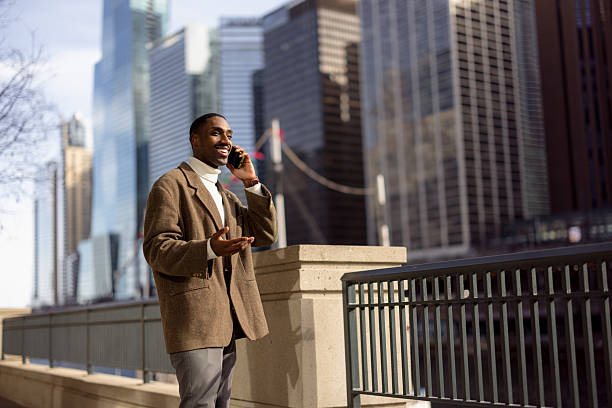 istock Young businessman talking on the phone in chicago's financial district 2229010515