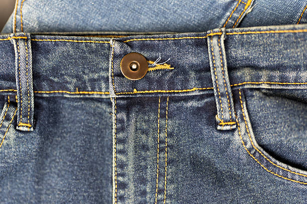 istock Front of blue jeans with button and belt loops 2229012931