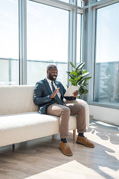 istock Businessman having a video call in a bright modern office space 2229013738