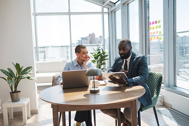 istock Professional colleagues discussing strategies in a bright modern office space 2229013773