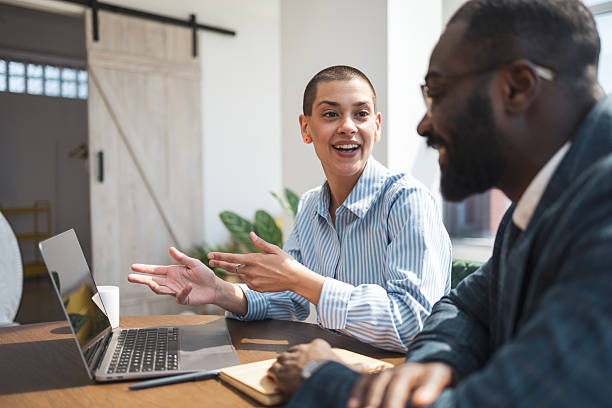 istock Business professionals collaborating in a bright office setting during sunlight hours 2229013785