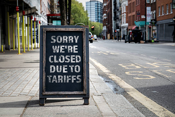 istock Sorry we're CLOSED due to tariffs. Foldable advertising poster on the street 2229014843