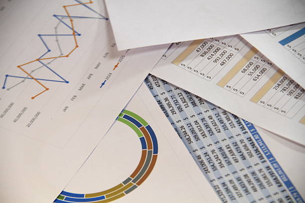 Businessman analyzing data charts and reports for marketing strategy, financial planning, accounting, and business development in modern office