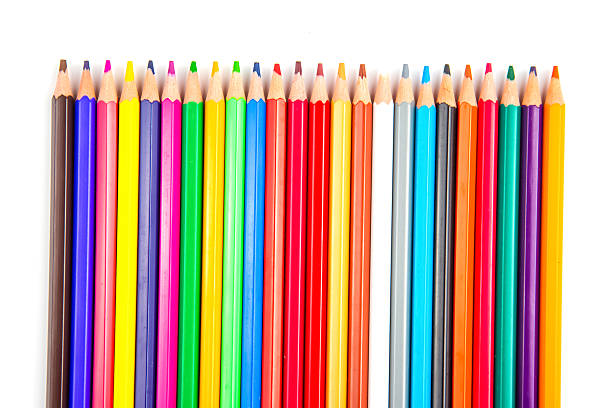 A row of vibrant colored pencils in a wave design on a white background. Ideal for art, education, and design themes with a lively and colorful aesthetic.