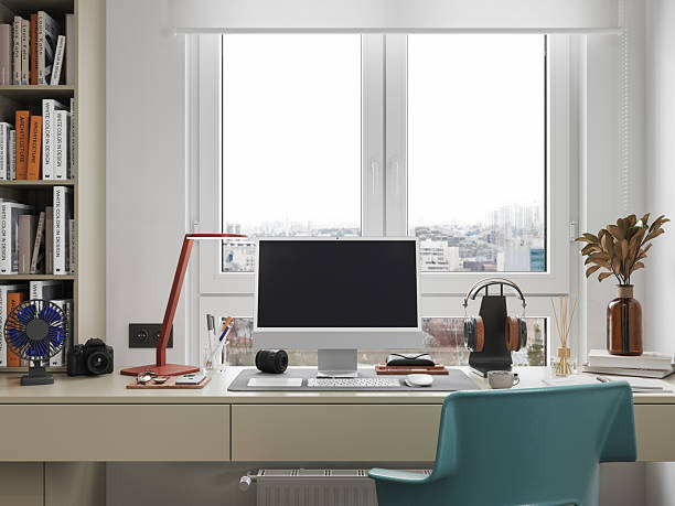 istock Modern Home Office Desk Setup with Computer and Accessories by the Window 2229021201