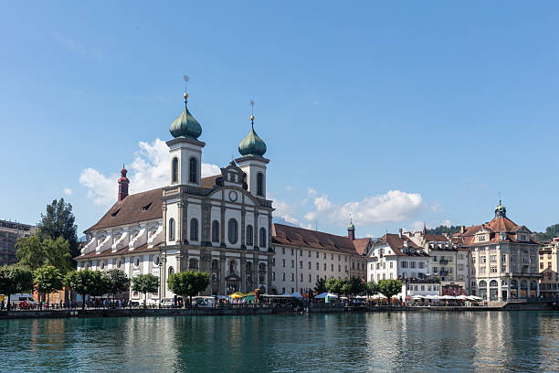 Stunning view of Kapellbrucke, the iconic Chapel Bridge, showcasing the picturesque beauty of Lucerne, Switzerland