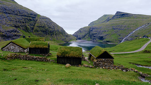 istock Captivating village in the Faroe Islands surrounded by dramatic cliffs and serene waters 2229025173