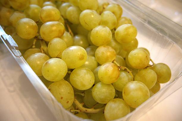 istock Green grapes in plastic transparent container close-up 2229025783