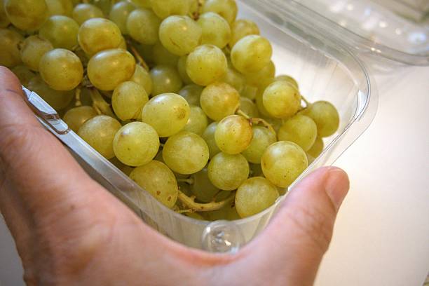 istock Green grapes in plastic transparent container close-up 2229025814