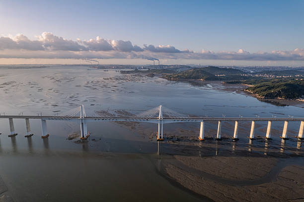 istock Cross sea railway bridge on mudflat 2229028602