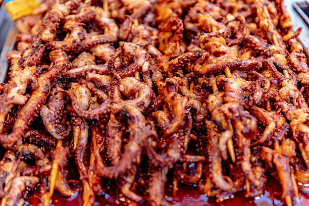 Freshly grilled spicy squid skewers