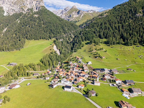 istock Small Mountain Village Surrounded by Green Forests 2229034257
