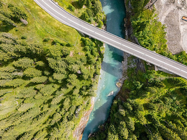 istock Aerial View of Bridge Over Mountain River 2229035703