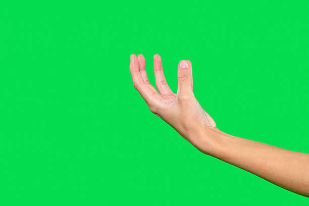 istock Hand gesture with open fingers against a green background showcasing movement and expression 2229039486