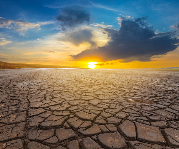 istock dry cracked earth in light of evening sun 2229040053