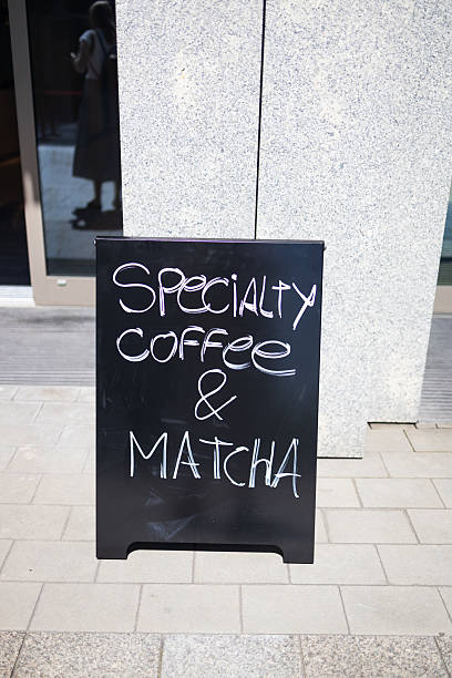 istock Chalkboard sign with Specialty Coffee and Matcha outside cafe 2229040803