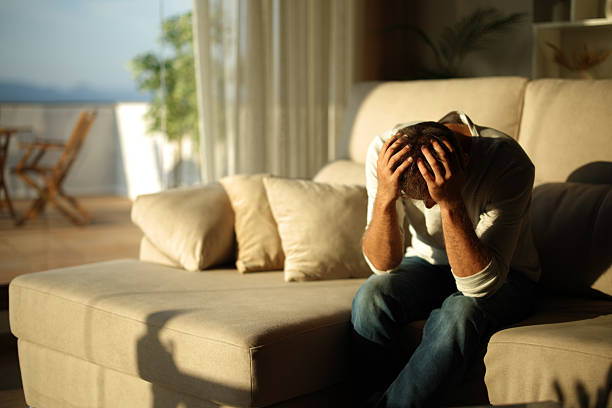 istock Sad and desperate man at home at sunset 2229042246