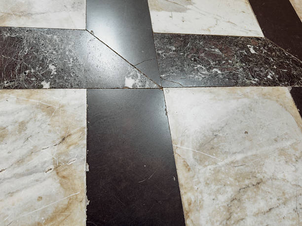 istock Worn geometric marble floor pattern with black and beige tiles in historical building interior, ancient architecture texture detail 2229046064