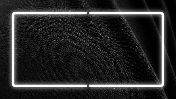 Neon light and glowing rectangle frame. Dark fabric texture, showing the intricate woven pattern of black material with subtle highlights and shadows.