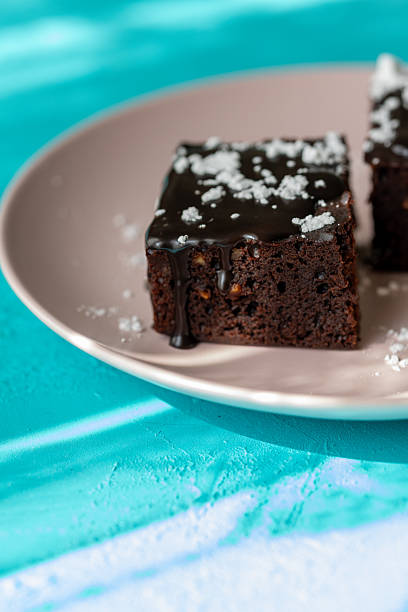Vegan chocolate brownie on plate close up