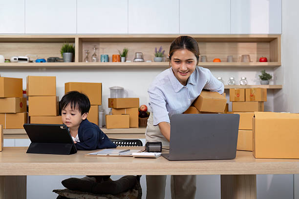 istock Busy mom multitasking with son and home business 2229047954